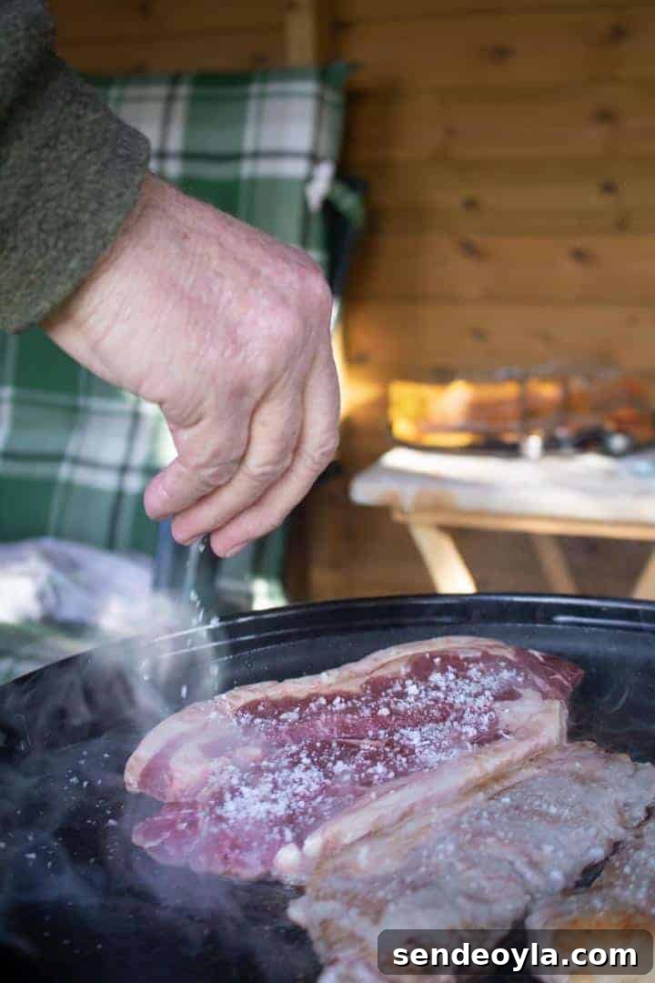 sprinklinng sea salt on Lincoln Red Beef sirloin steaks