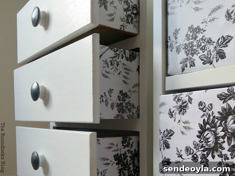 Adding toile contact paper on sides of drawers for the nightstand makeover.