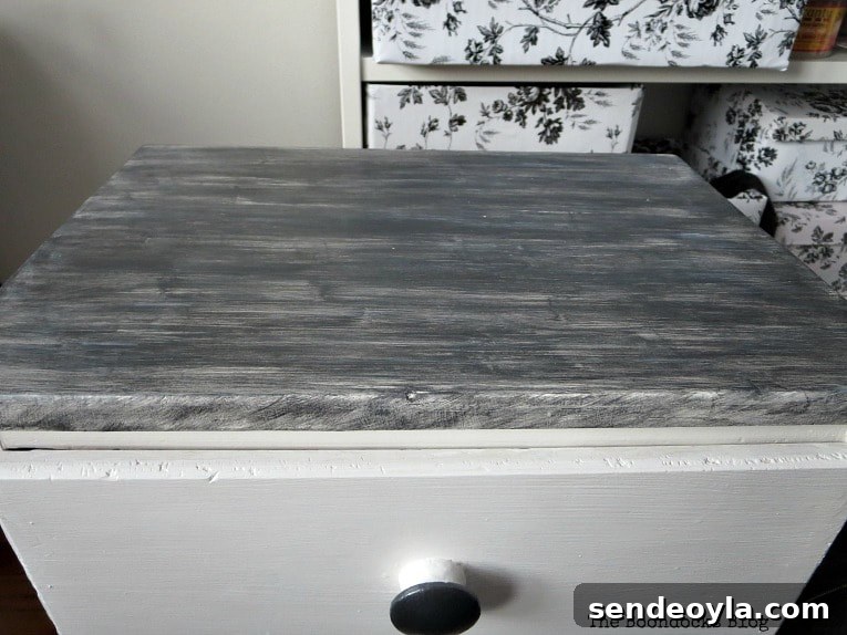 Painted top of nightstand in metallic pearl black.