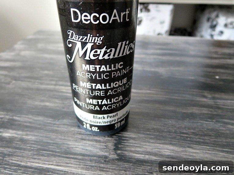 Close up of DecoArt metallic black acrylic paint.