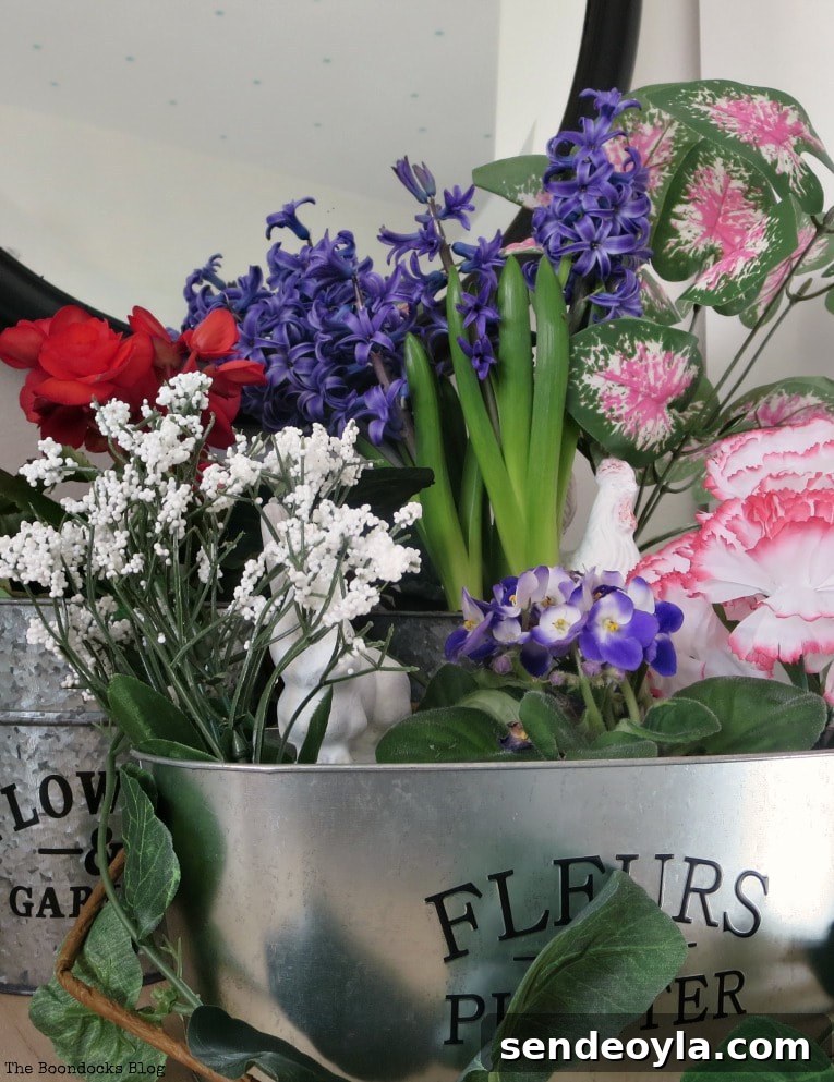 How to Look Like You Have a Green Thumb with a Planter Box 16 Real and faux flowers placed in three galvanized metal planter boxes