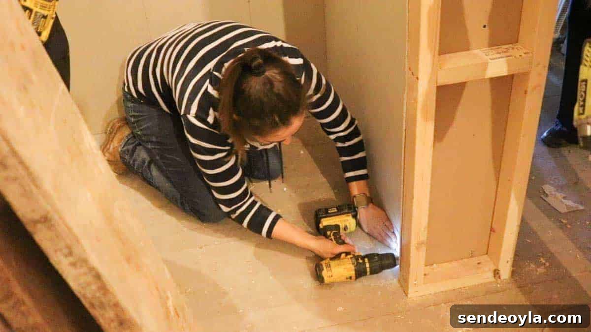 How to Build a Partition Wall: Step-by-Step DIY Guide 23 Filling in the gaps near the skirting board