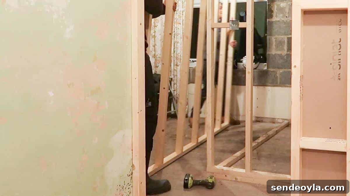 How to Build a Partition Wall: Step-by-Step DIY Guide 10 creating an internal wall by slotting in a studded wall