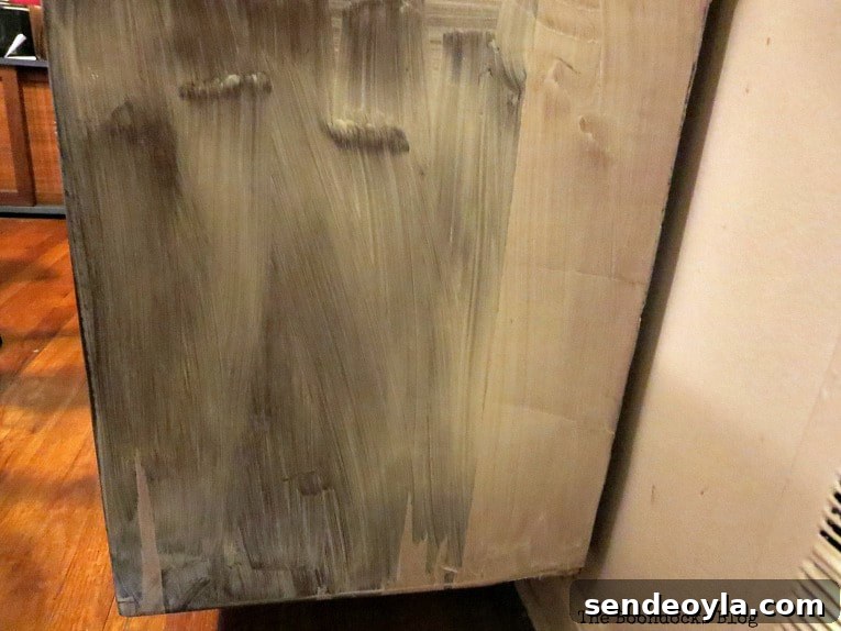 Adding the wood reclaim to the side of the cabinet.