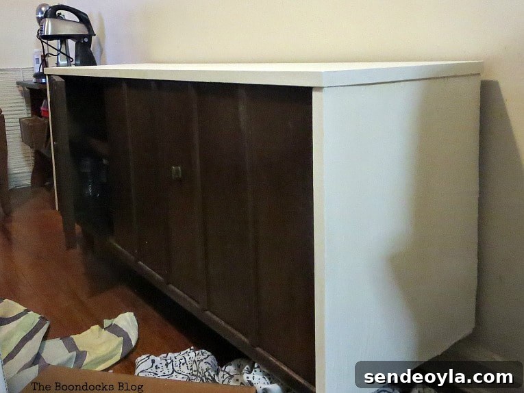 The bottom cabinet after it's been painted with white chalk finish paint.