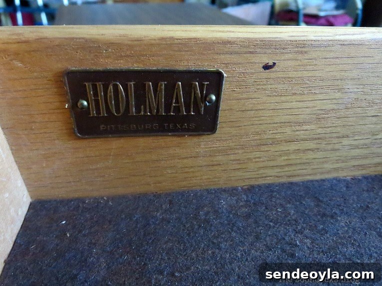 Metal label of the manufacturer Holman.