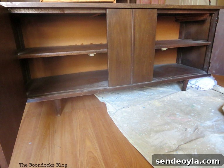The bottom part of the cabinet with opened doors.