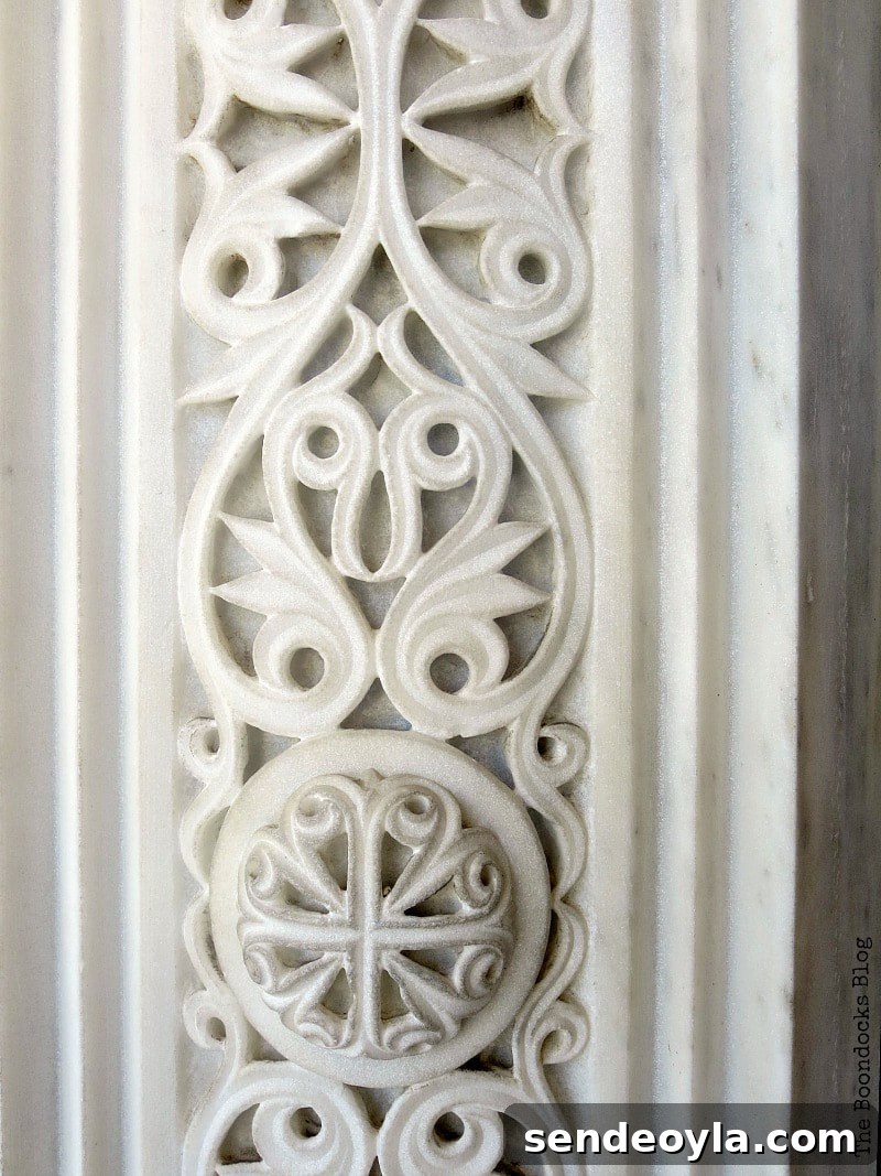 Carved marble detail around the doorway