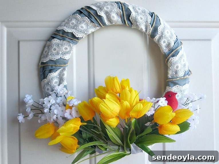 Spring wreath with white flowers and yellow tulips