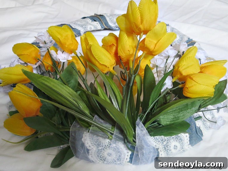 Adding yellow tulips on the bottom of wreath