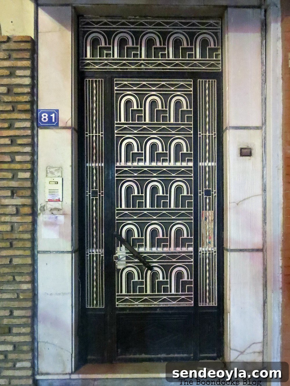 Black and white metal door with sixties style design