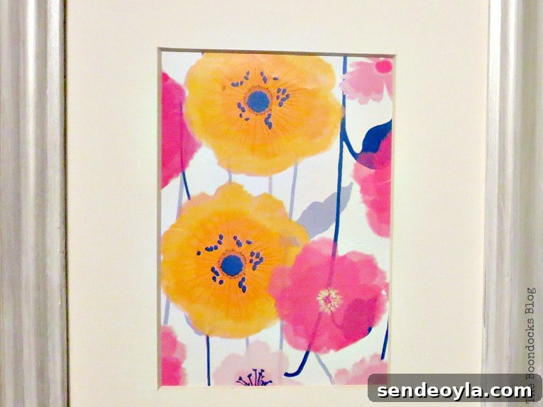 Quick Spring Art Ideas to Refresh Your Home 3 Close up of the flower wrapping paper placed inside the picture frame.