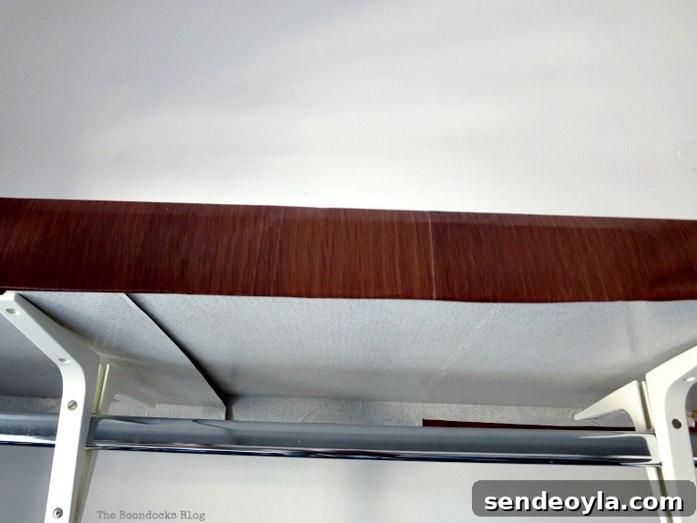 DIY Clothes Rack Cover: Step-by-Step Guide 6 Cardboard covered with wood colored contact paper.