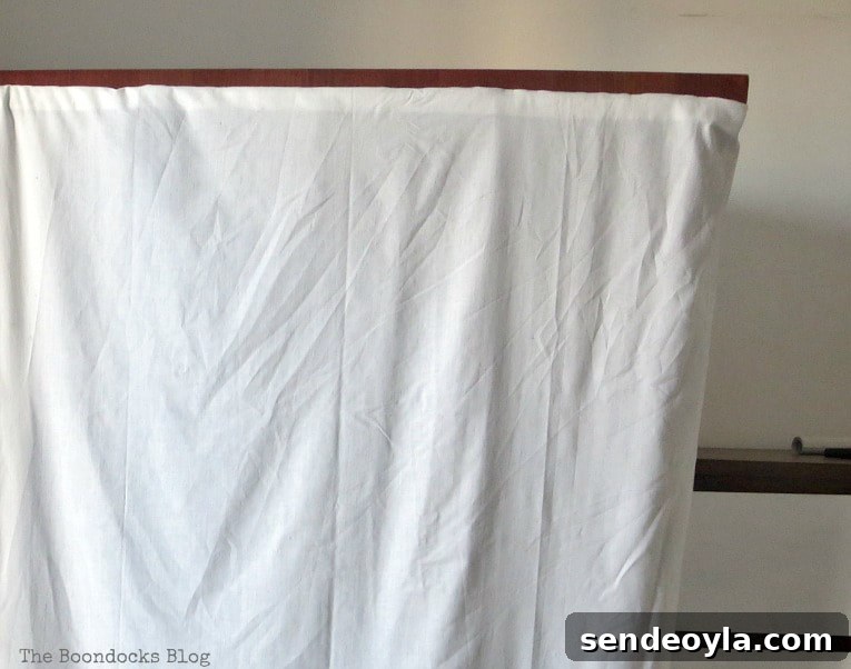 DIY Clothes Rack Cover: Step-by-Step Guide 9 Close up of the white sheet.
