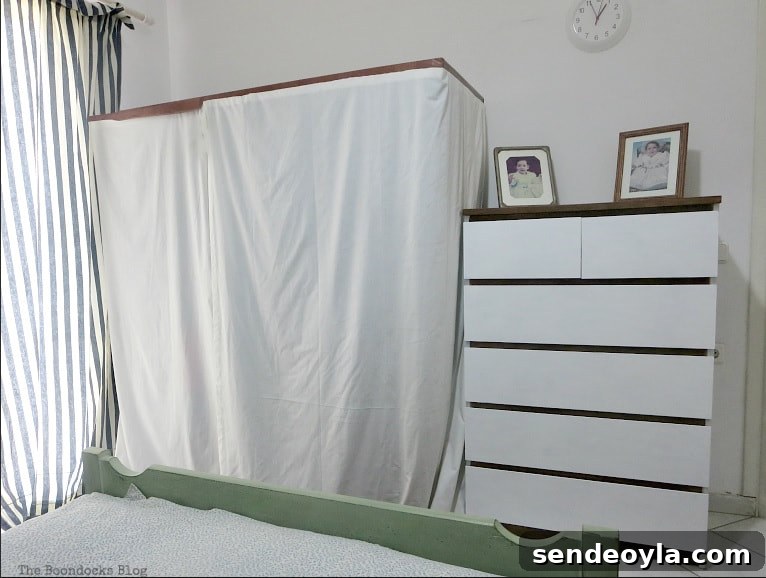 DIY Clothes Rack Cover: Step-by-Step Guide 10 Finished clothes rack with cover beside a painted white Ikea Malm dresser.