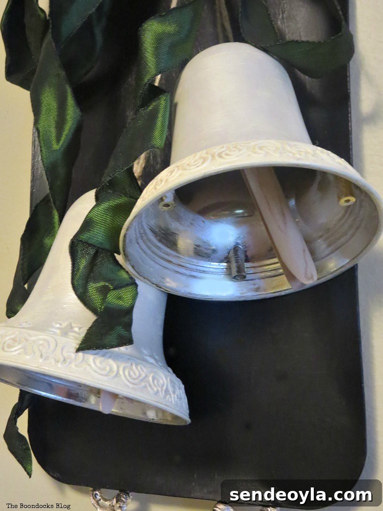 adding a clothespin to the bell, How to Create a Pretty Holiday Decor with an Old Tray
