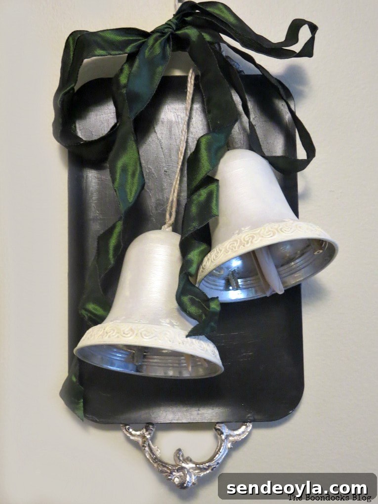two bells displayed on the chalkboard tray with green ribbon, How to Create a Pretty Holiday Decor with an Old Tray