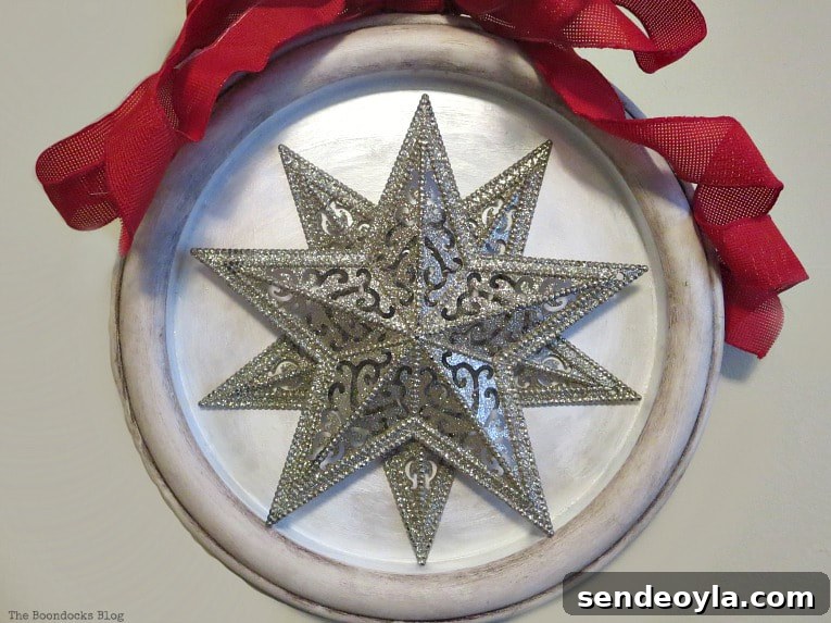 Final holiday wall decor made from stars and a clock frame