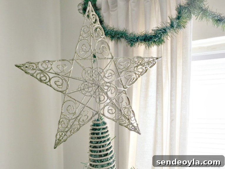 Gold star at the top of the tree