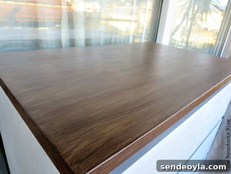 The finished top of the dresser in walnut brown.