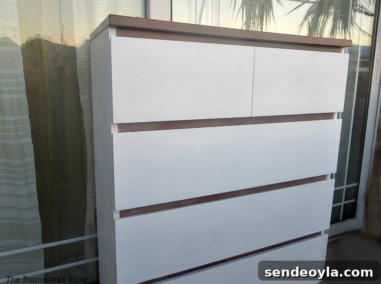 Finished dresser painted white and walnut.