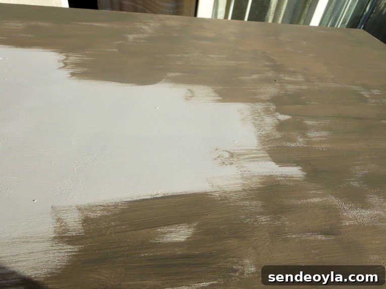 Painting the top of the dresser with a brown color.