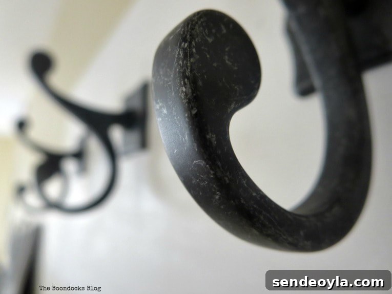 DIY Farmhouse Coat Rack for Your Entryway 10 curve of the metal hook, How to Make a Wooden Wall Hanger www.theboondocksblog.com