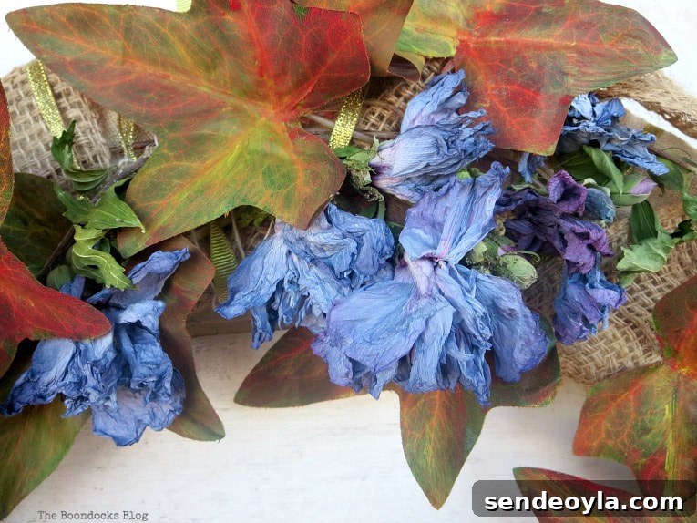 How to Turn a Dollar Store Vine into a Fall Wreath 9 Padding dried flowers to the wreath