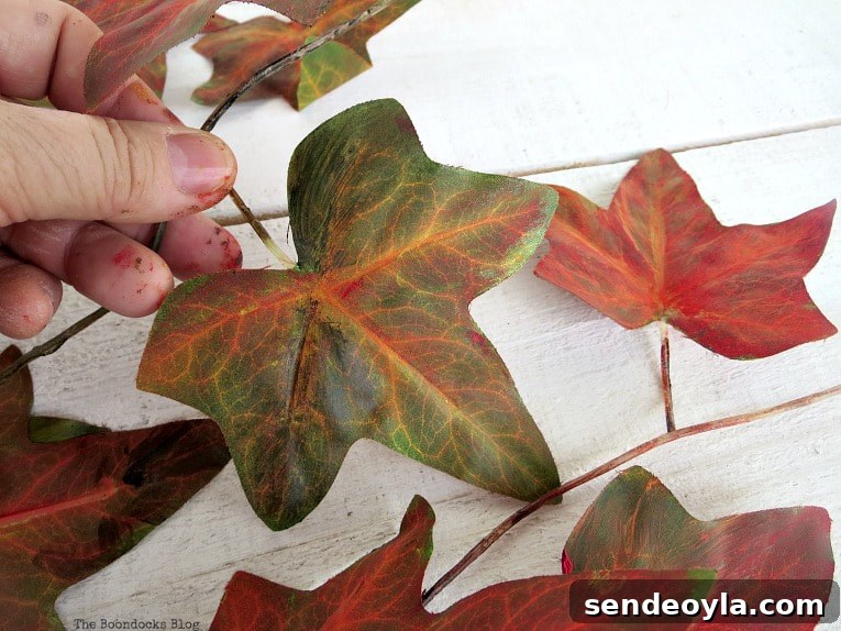 How to Turn a Dollar Store Vine into a Fall Wreath 4 Painting the plastic leaves
