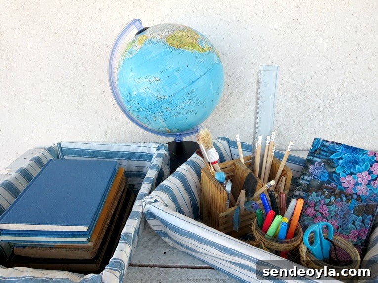 Upcycle Broken Plastic Baskets into Fabric Storage Bins 12 Baskets full of school supplies and books, placed next to a globe.
