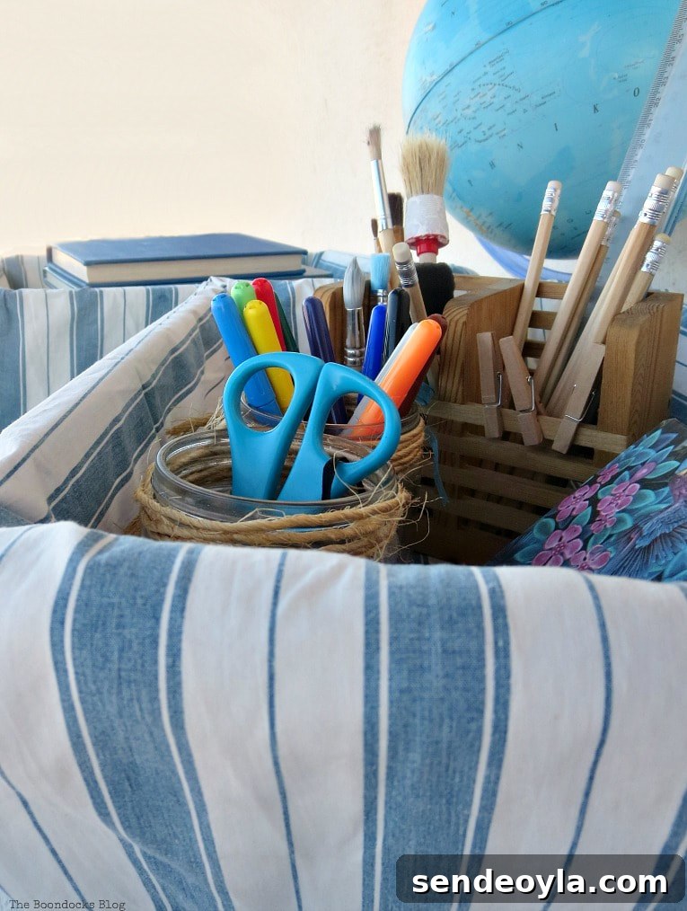 Upcycle Broken Plastic Baskets into Fabric Storage Bins 15 Close up of the school supplies inside the basket.