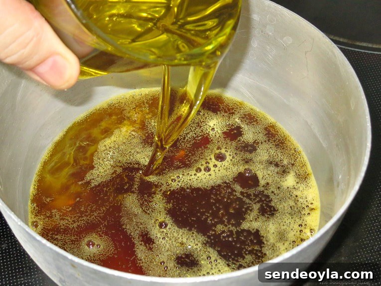 DIY Beeswax Furniture Polish Recipe and Care Tips 8 Adding olive oil to the melted beeswax.