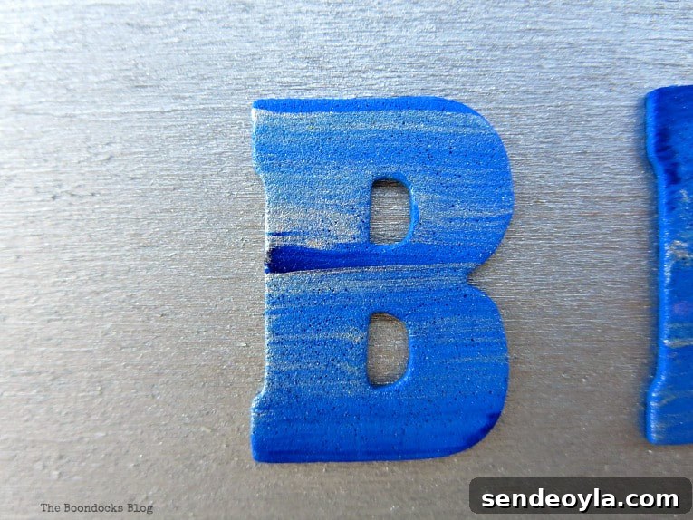 Blue painted letters, A Nautical Sign that is So Close to Amazing