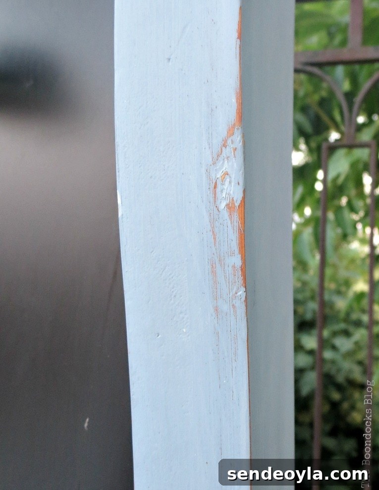 How to Upcycle a Vintage Chalkboard Stand 7 Distressing the wood with sandpaper