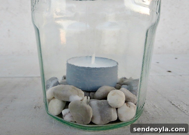pebbles and tea light inside jar