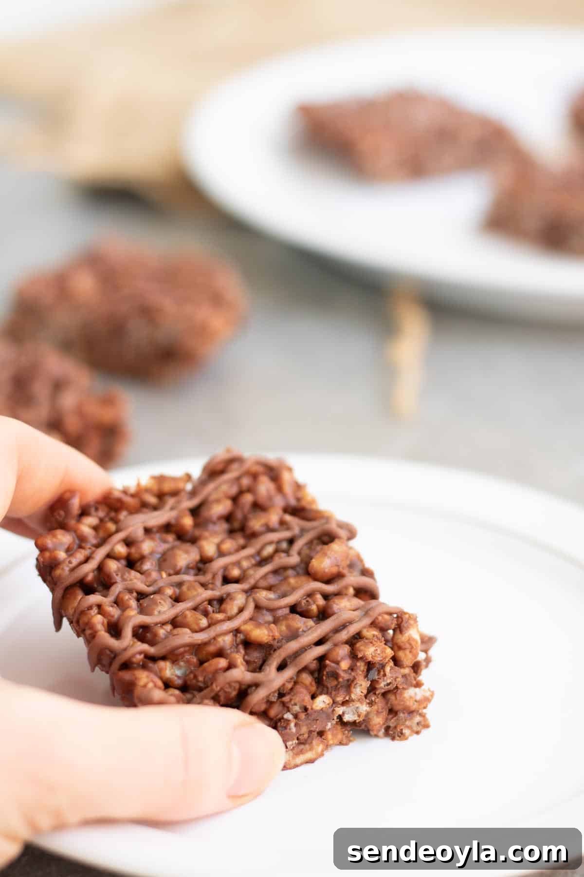 grabbing rice krispies treat with chocolate orange