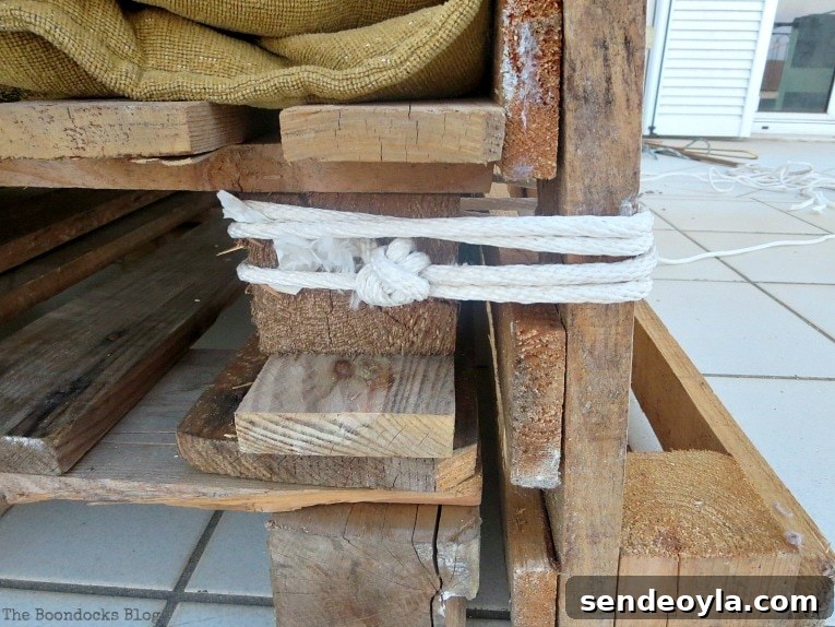How to Build a DIY Pallet Sofa Without Tools 5 tying the pallets together with rope