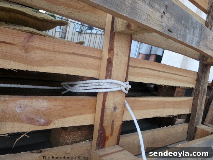 How to Build a DIY Pallet Sofa Without Tools 6 tying the pallets together to form a backrest