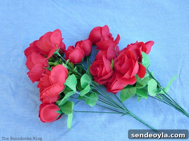 DIY Colorful Fence with Dollar Store Flowers 3 2 bouquets of artificial red roses.