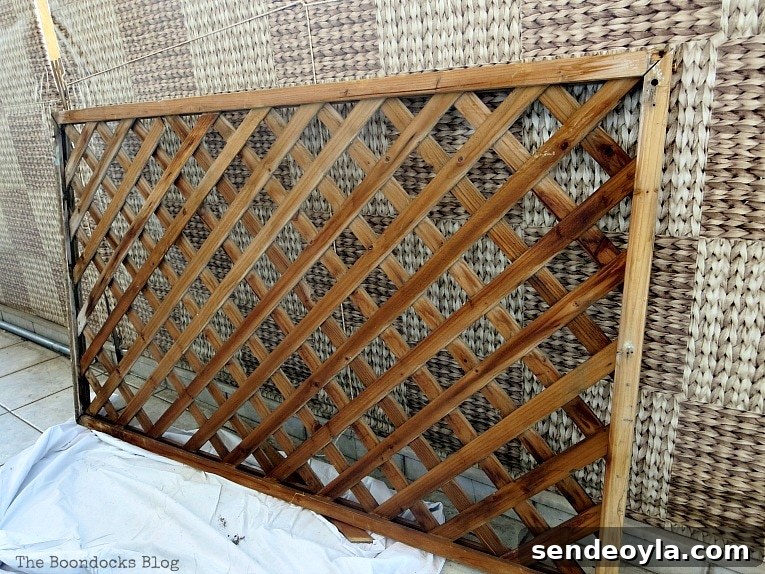 DIY Colorful Fence with Dollar Store Flowers 4 Lattice panel leaning against a wall.