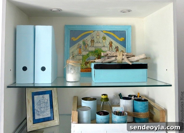 top of bookcase one, with magazine files, boxes and tin cans, Pretty and Practical Bookcases the Easy Way