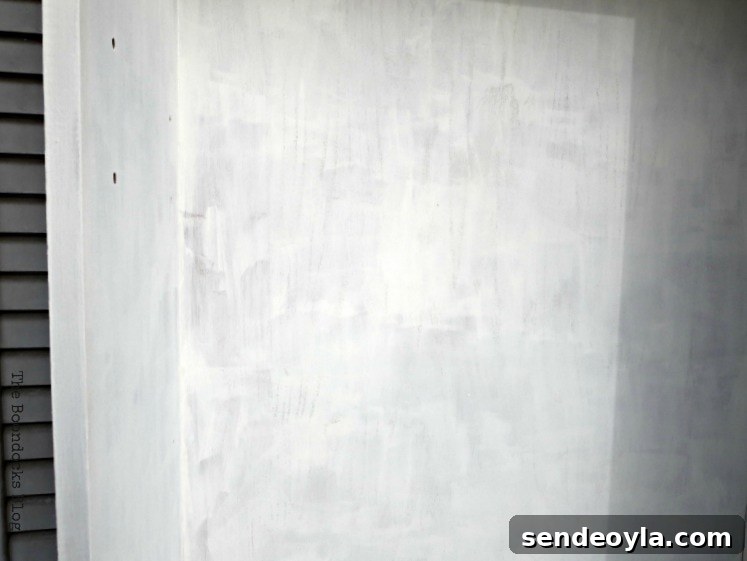 Avoid These Mistakes When Upcycling Bookcases 8 Second coat of paint on the interior.