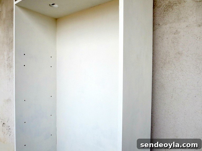 Avoid These Mistakes When Upcycling Bookcases 9 Upcycled bookcase painted white.