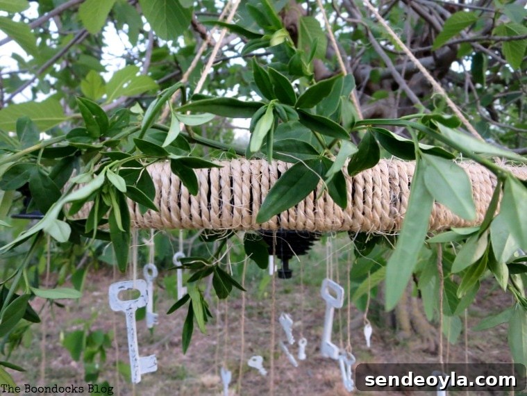How to Upcycle a Tire Rim into a Unique Wind Chime 16 adding leaves to the top of the wind chime, How to Re-purpose a tire rim into a Unique wind chime - Int'l Bloggers Club