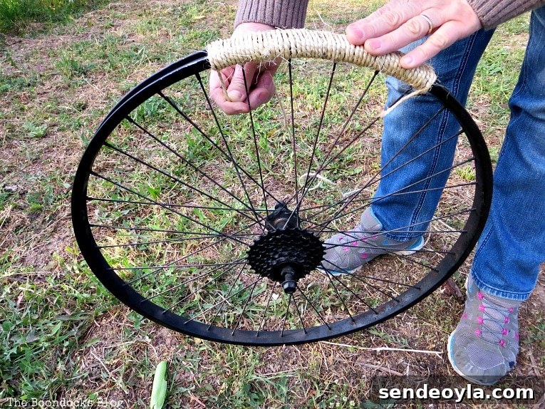 wrapping the tire rim with twine, How to Re-purpose a tire rim into a Unique wind chime - Int'l Bloggers Club
