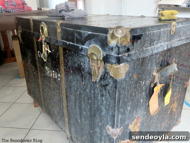 Vintage metal trunk before restoration.