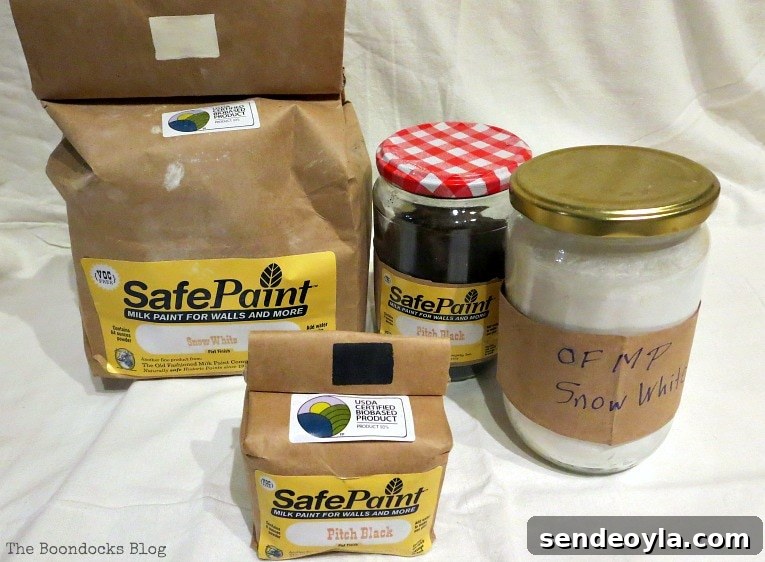 Cans of Old Fashioned Milk Paint in Snow White and Pitch Black.