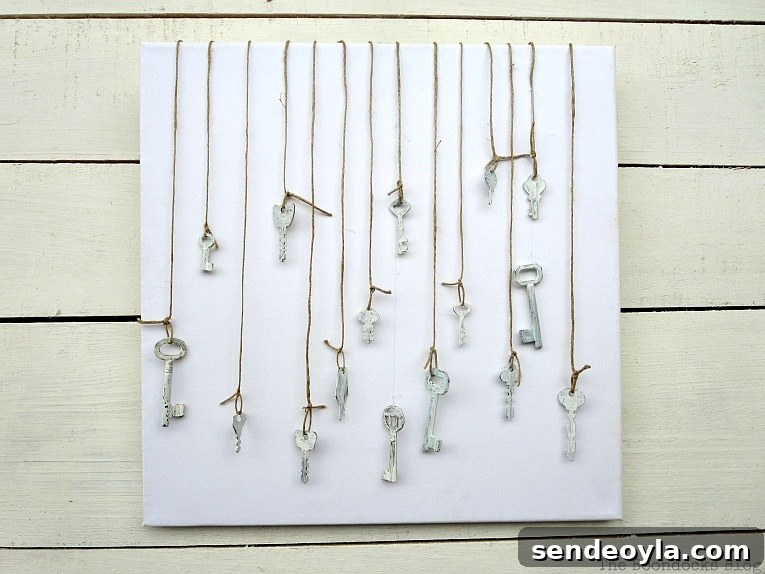 Canvas with keys hanging in front, How to Make Simple Canvas Wall Art with Keys, www.theboondocksblog.com