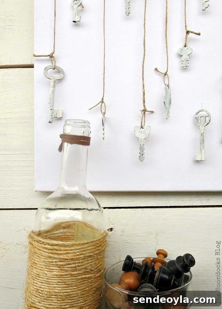 How to make simple canvas wall art with keys tied with thin twine and hanging in front of blank canvas, How to Make Simple Canvas Wall Art with Keys