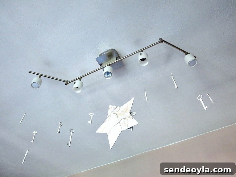 light fixture with dangling keys, How to Make Simple Canvas Wall Art with Keys, www.theboondocksblog.com